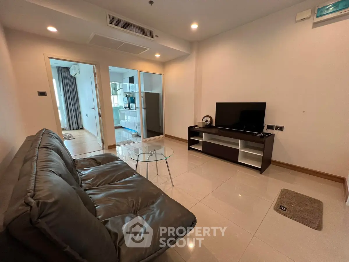 Modern living room with sleek furniture and open layout, perfect for urban living.