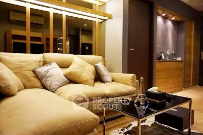 Luxurious living room with plush sofa and modern decor in upscale apartment