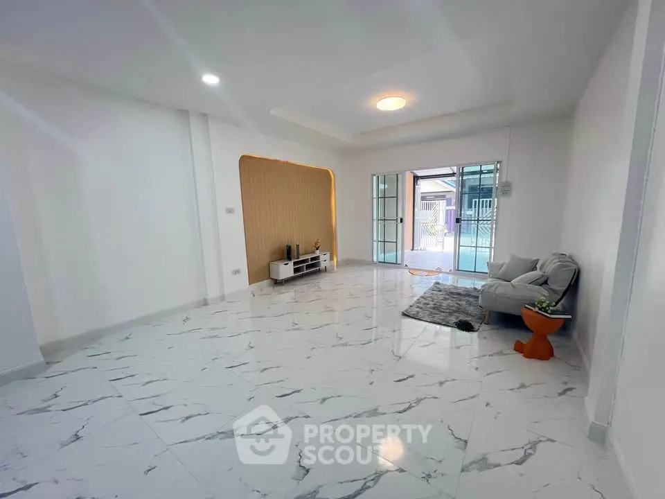 Spacious modern living room with marble flooring and stylish decor
