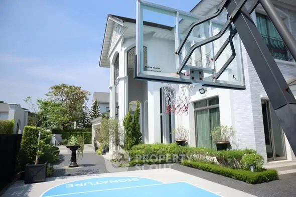 Luxurious modern home with private basketball court and lush garden, perfect for sports enthusiasts and family gatherings.