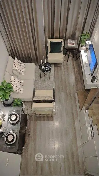 Modern living room with stylish decor and open layout, featuring cozy seating and elegant dining area.