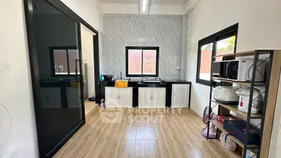 Modern kitchen with sleek black countertops and open shelving