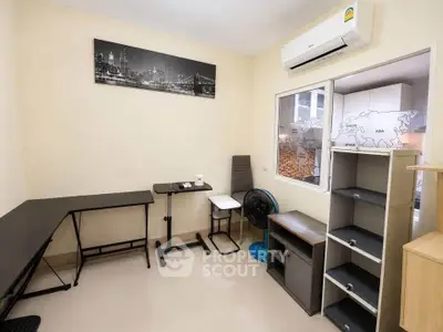 Modern study room with sleek furniture and air conditioning, perfect for productivity and comfort.