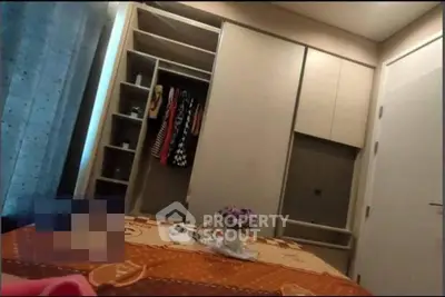 Cozy bedroom with built-in wardrobe and stylish decor