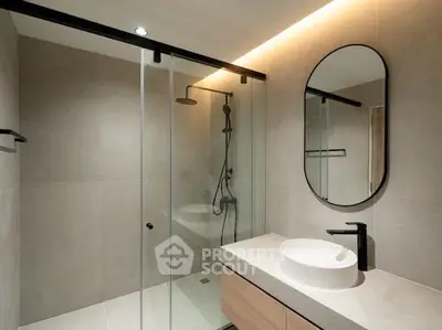 Modern bathroom with sleek shower and elegant vanity design