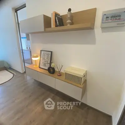 Modern interior with stylish shelving and decor in a cozy living space.