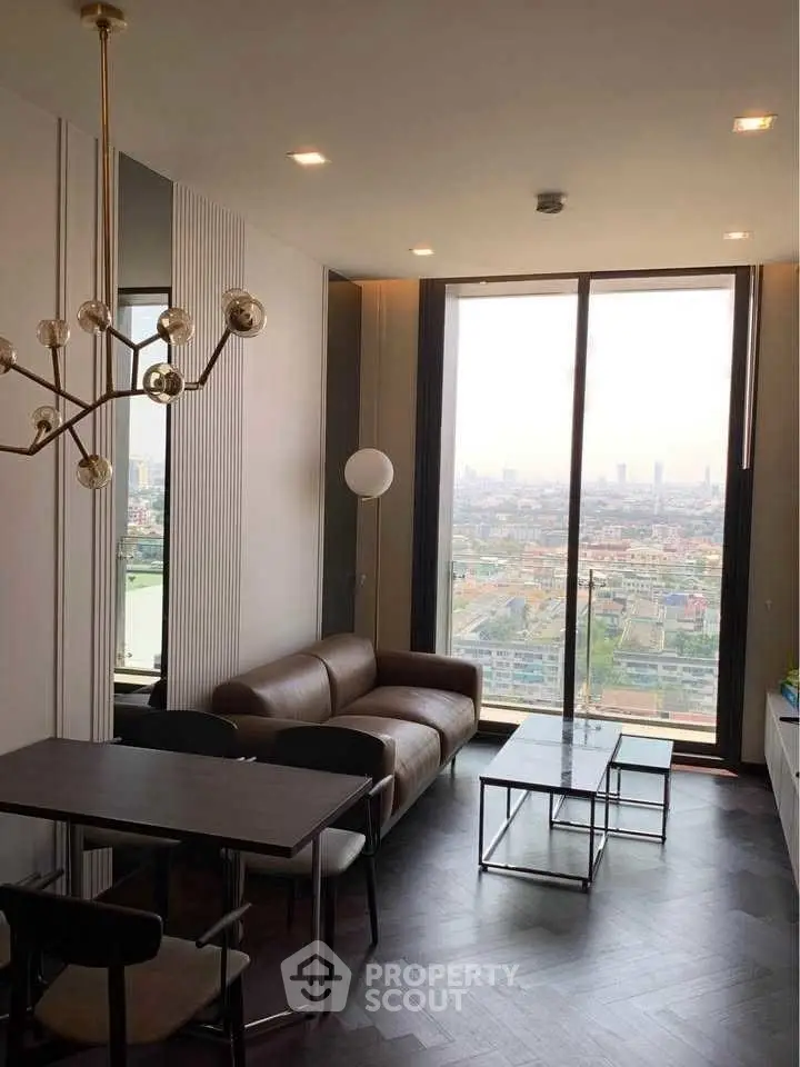 Modern living room with panoramic city view and stylish furnishings.