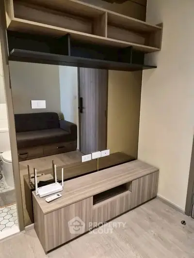 Modern living room with stylish wooden furniture and built-in shelving
