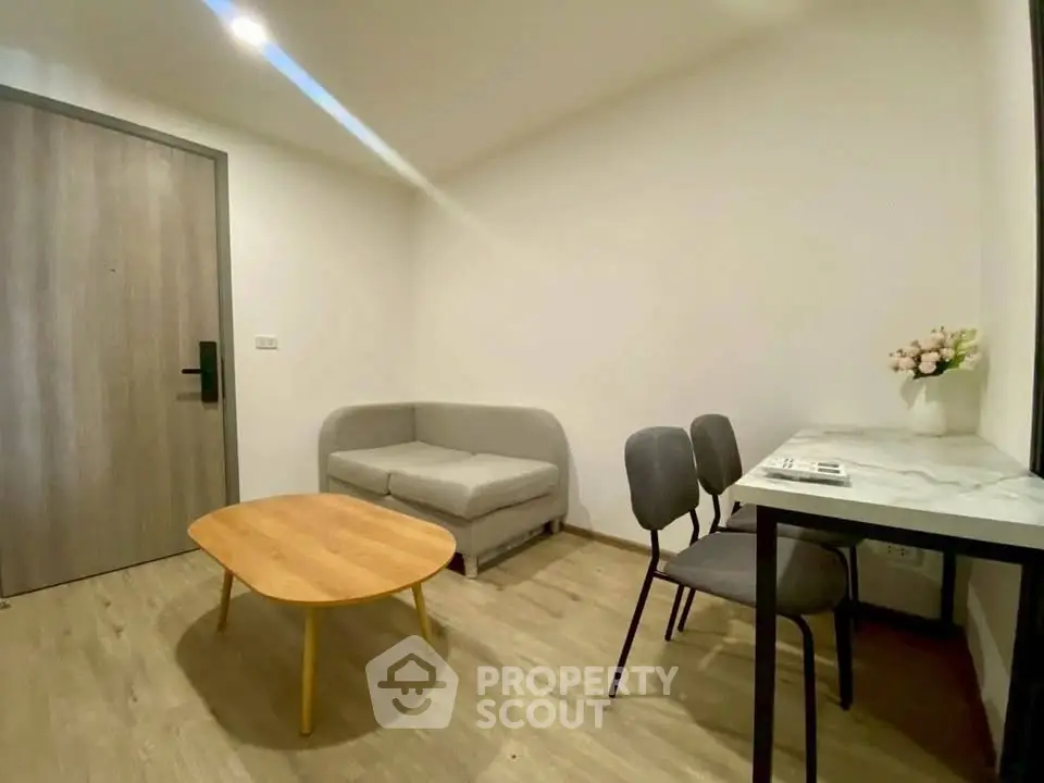 Cozy modern living room with minimalist furniture and wooden flooring