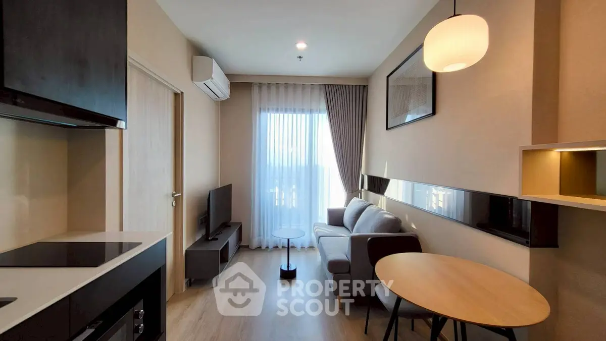 Modern living room with sleek furniture and natural light, perfect for urban living.