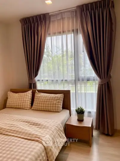 Cozy bedroom with stylish curtains and natural light