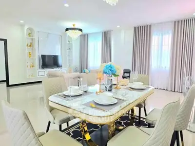 Luxurious modern dining room with elegant decor and chandelier lighting