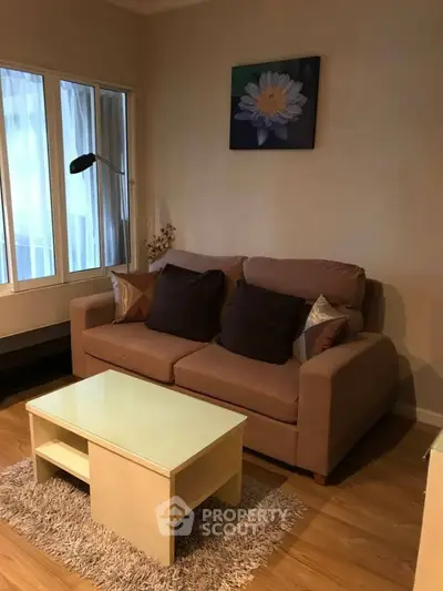 Cozy living room with a comfortable sofa and modern decor.