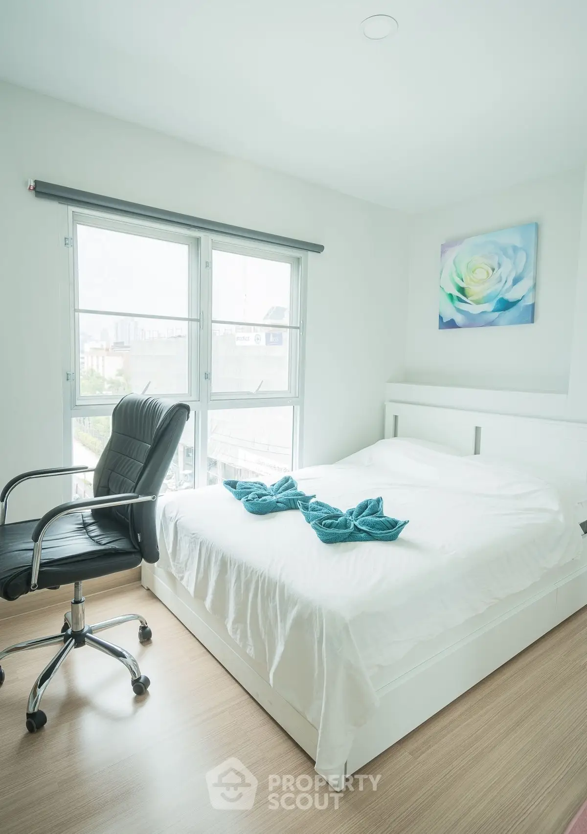 Bright and airy bedroom with modern decor and large windows