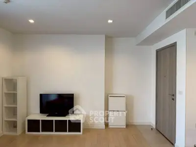 Modern minimalist living room with TV and wooden flooring