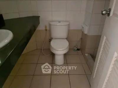 Modern bathroom with tiled floor and sleek fixtures