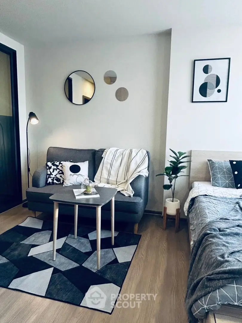 Modern living room with stylish decor and cozy seating area in a contemporary apartment.