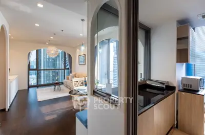 Luxurious high-rise apartment with stunning city views and modern open-plan living area.