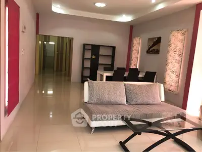 Spacious modern living room with elegant decor and dining area