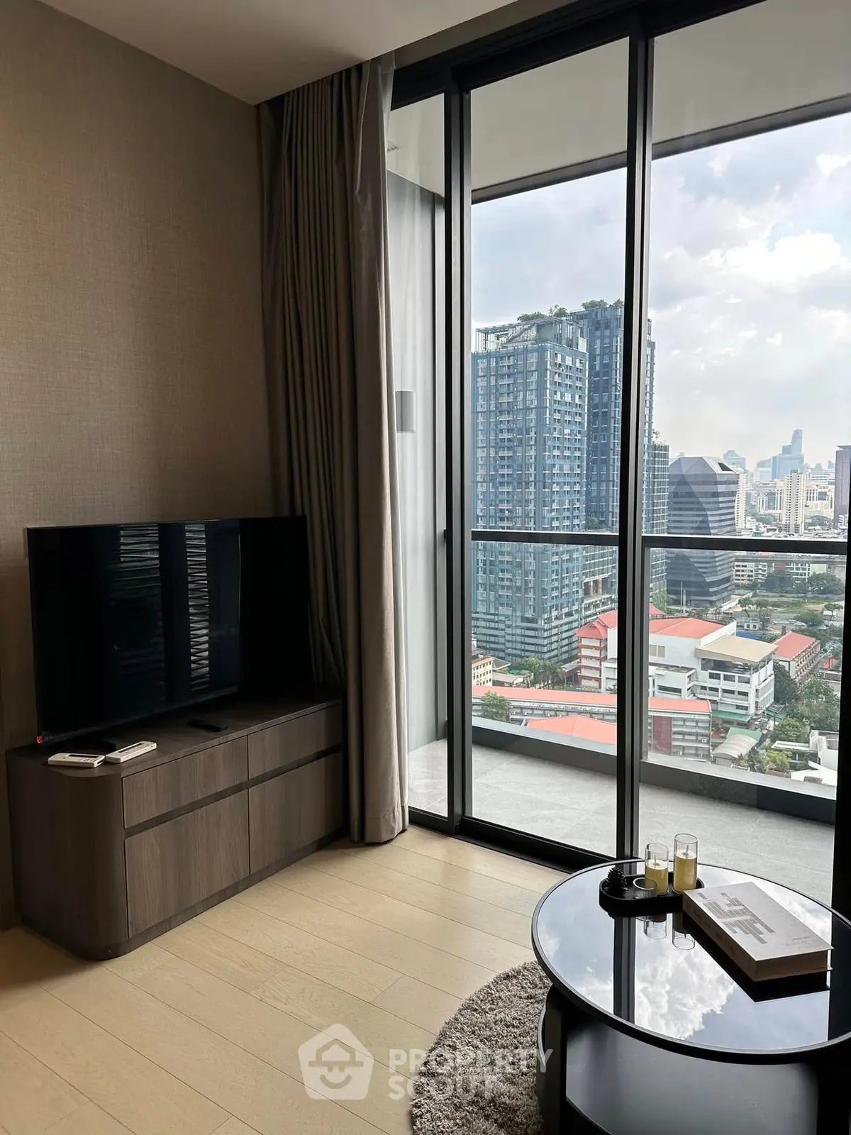 Modern living room with city view and sleek furniture