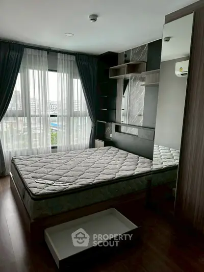 Modern bedroom with large windows and stylish decor