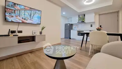 Modern open-plan living room with stylish kitchen and elegant decor