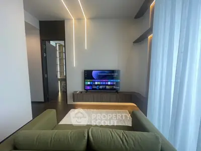 Modern living room with sleek TV setup and stylish lighting