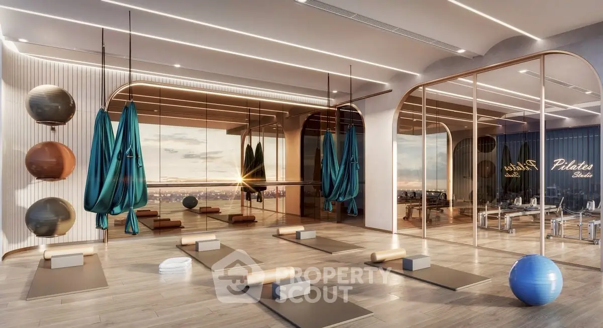 Luxurious Pilates studio with panoramic city views and modern design elements.