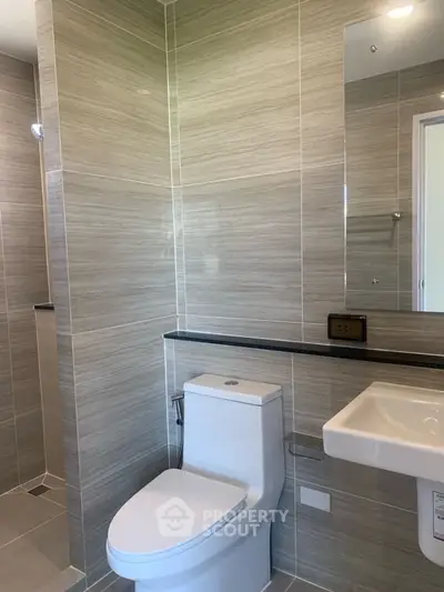 Modern bathroom with sleek fixtures and neutral tile design