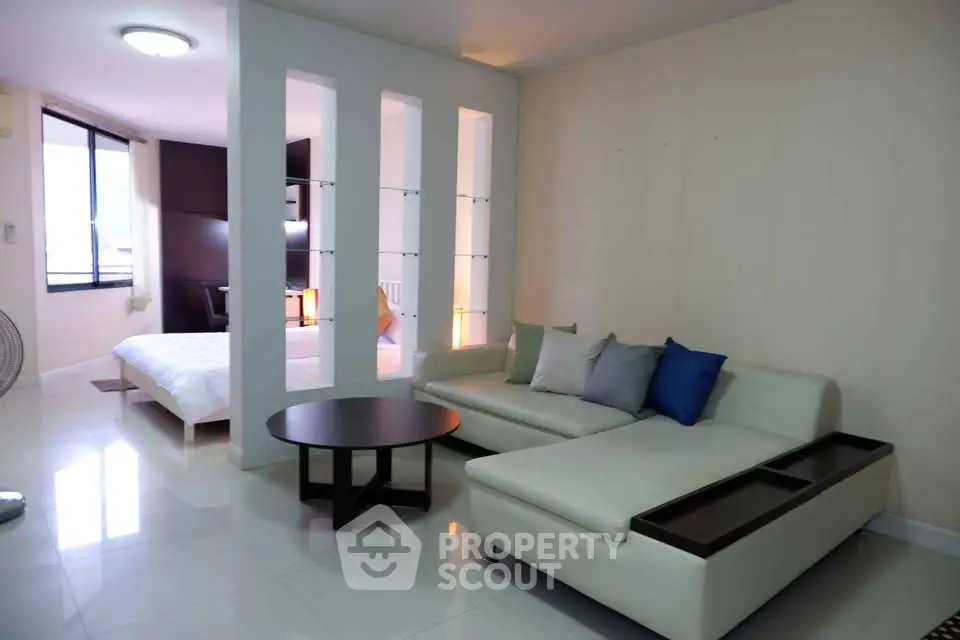 Modern living room with sleek sofa and stylish decor in open layout apartment