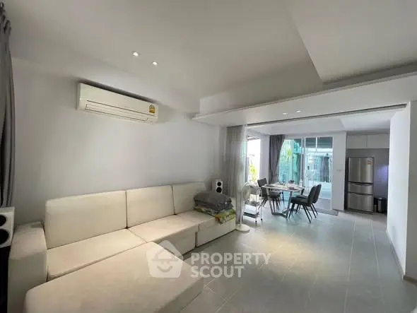 Spacious living room with modern open kitchen and dining area