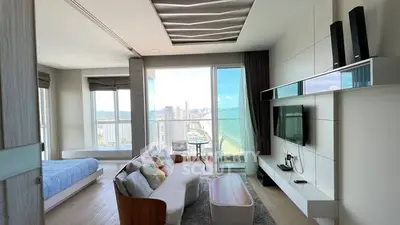 Modern living room with ocean view, open layout, and stylish decor