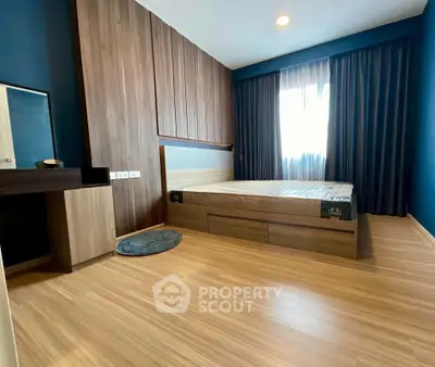 Modern bedroom with wooden flooring and stylish decor