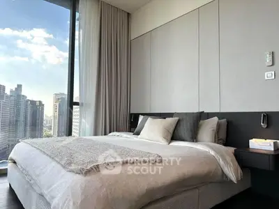 Luxurious bedroom with stunning city view and modern decor