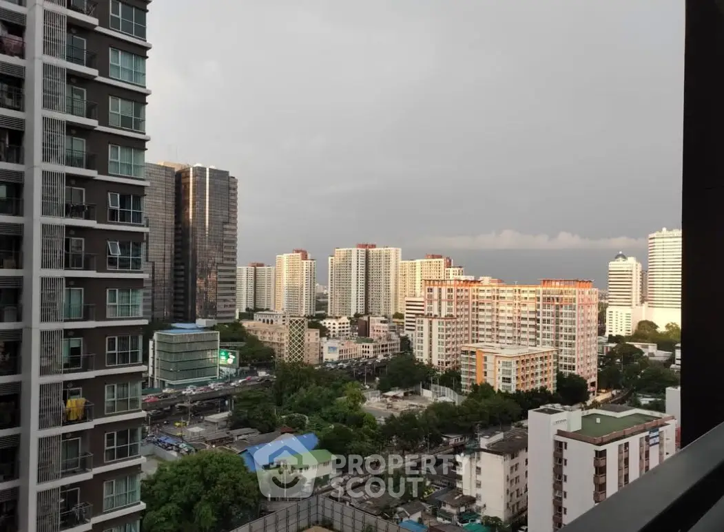Stunning cityscape view from high-rise apartment balcony at dusk.