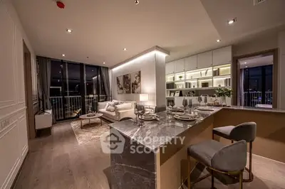 Luxurious open-layout living room with modern kitchen and elegant decor