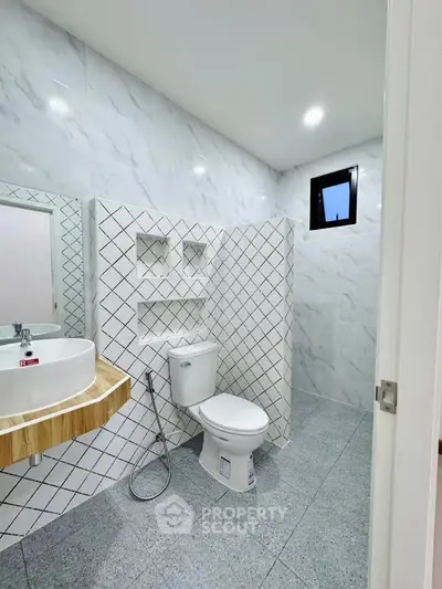 Modern bathroom with stylish tile design and sleek fixtures