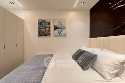 Modern bedroom with stylish decor and cozy bedding