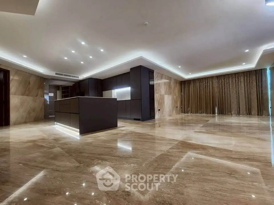Luxurious modern kitchen with marble flooring and sleek cabinetry
