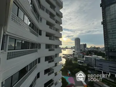 Stunning river view from high-rise apartment balcony at sunset