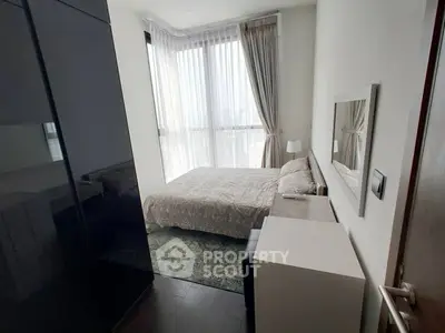 Modern bedroom with large windows and elegant decor