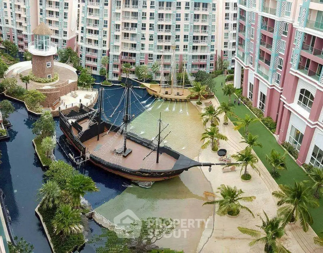 Unique residential complex with pirate ship-themed pool and lush landscaping.