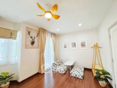 Charming living room with cozy seating and stylish decor, perfect for relaxation and entertaining.