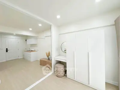 Spacious modern living area with minimalist design and ample natural light
