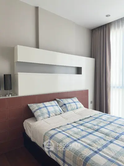 Modern bedroom with stylish headboard and natural light