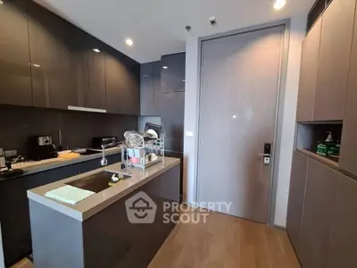 Modern kitchen with sleek cabinetry and island in contemporary apartment