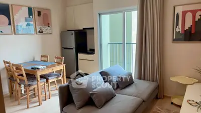 Modern living room with cozy sofa and dining area in stylish apartment