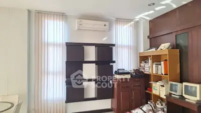 Spacious study room with modern shelving and air conditioning