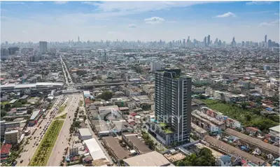 Stunning aerial view of urban skyline with high-rise buildings and bustling cityscape, perfect for real estate investment.