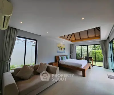 Spacious bedroom with garden view and modern decor in luxury property